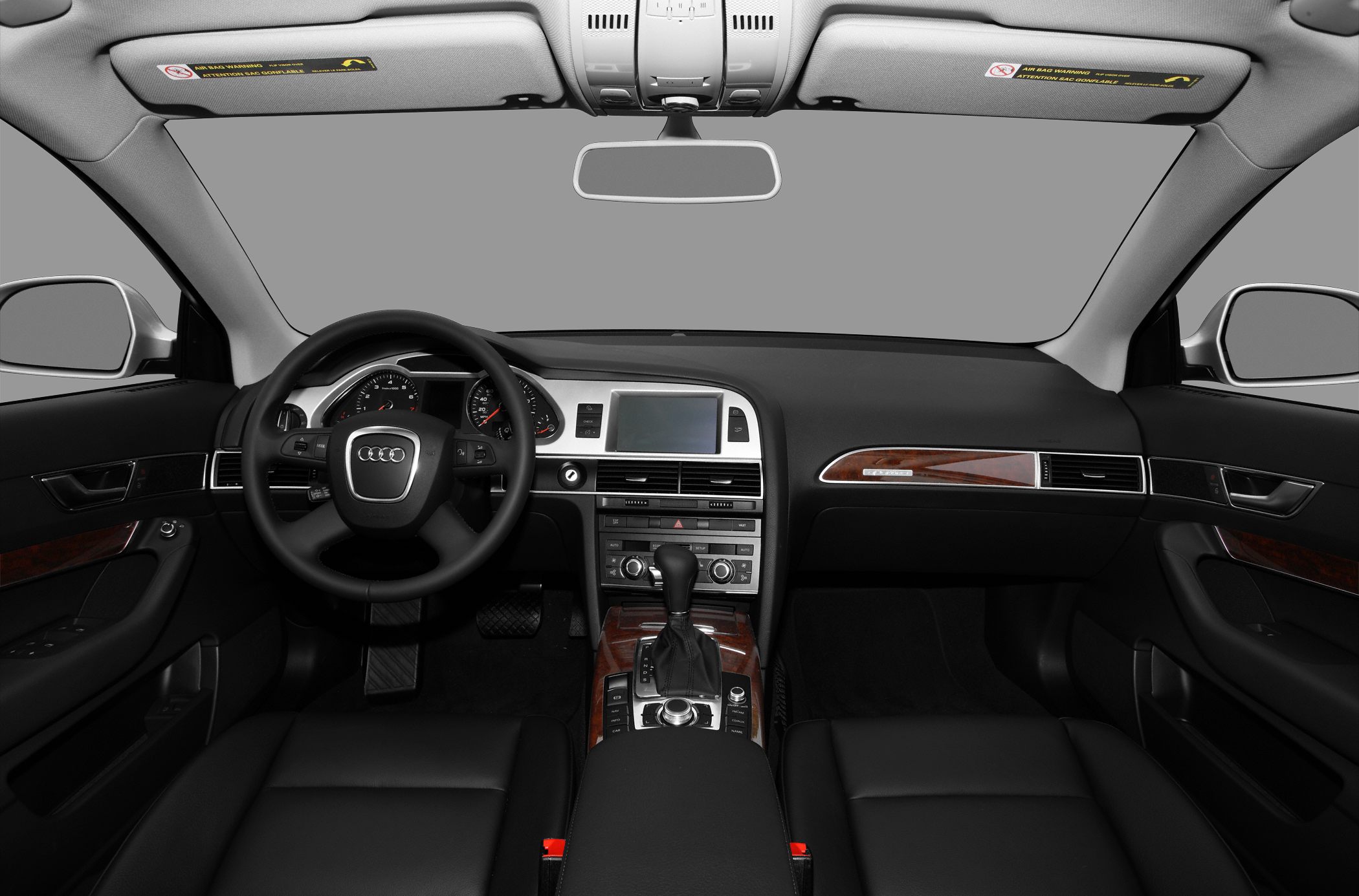 Interior dashboard with steering wheel, wood trim, and central console controls.
