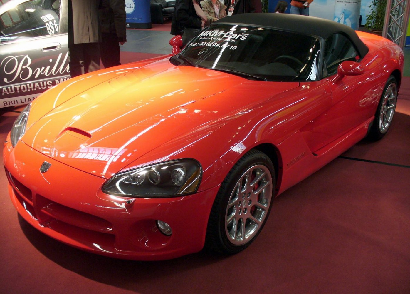 Front hood, headlights, and convertible roof of a sports car