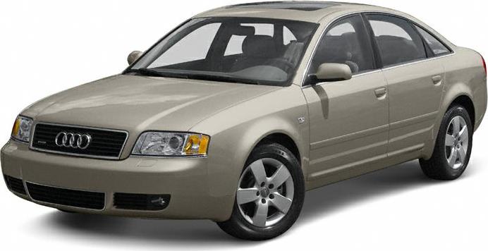 4-door beige sedan with dual headlights and 5-spoke alloy wheels