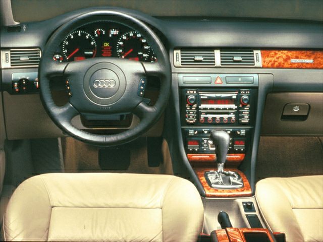 Leather steering wheel and wood trim dashboard with automatic gear shifter