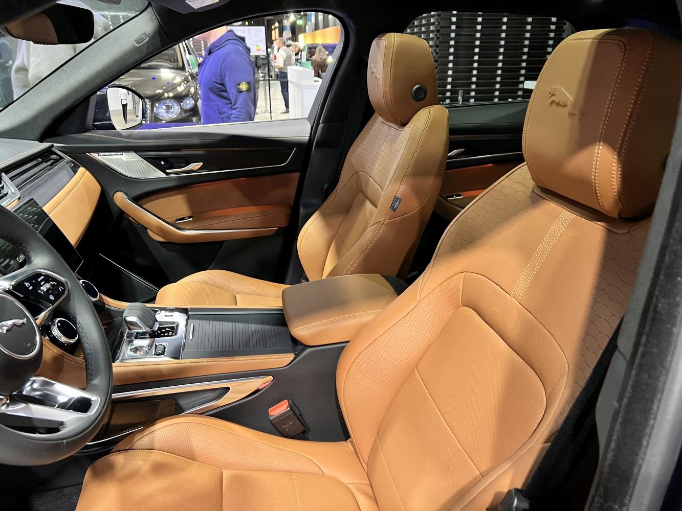 Tan leather front seats with detailed stitching and modern center console