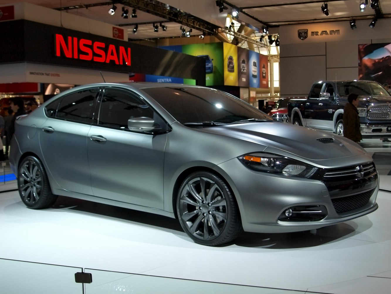 Side profile of a sedan with sporty alloy wheels and aerodynamic design