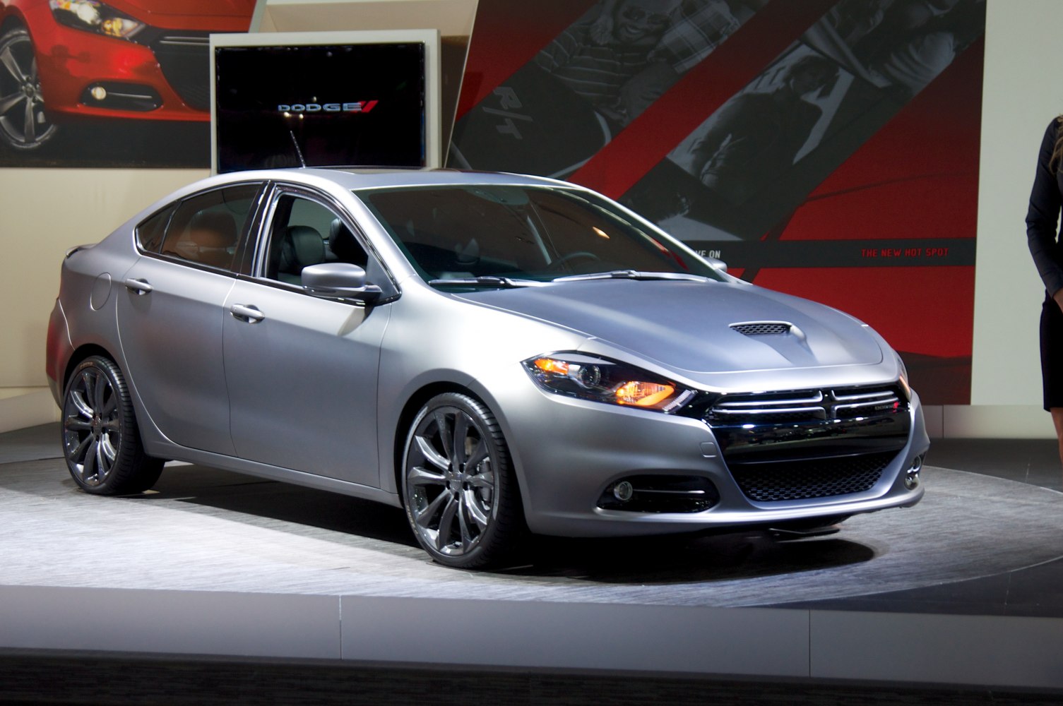 Silver sedan with sporty hood scoop and bold front grille