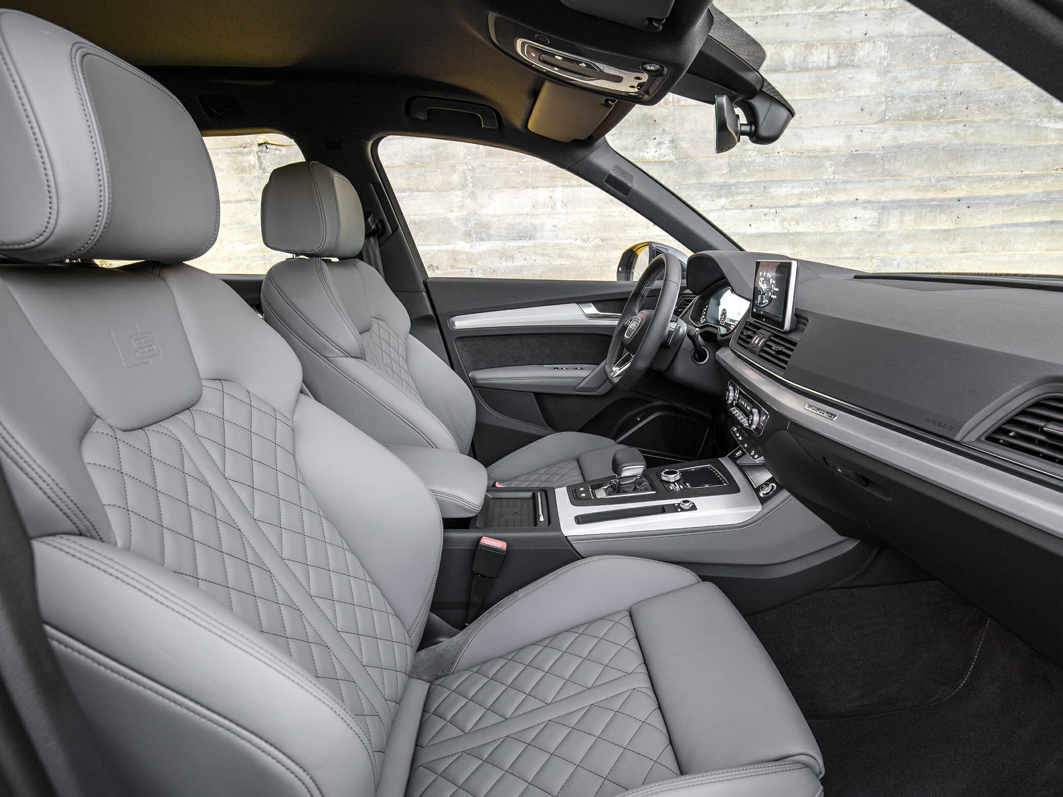 Premium quilted leather seats and modern dashboard with infotainment system
