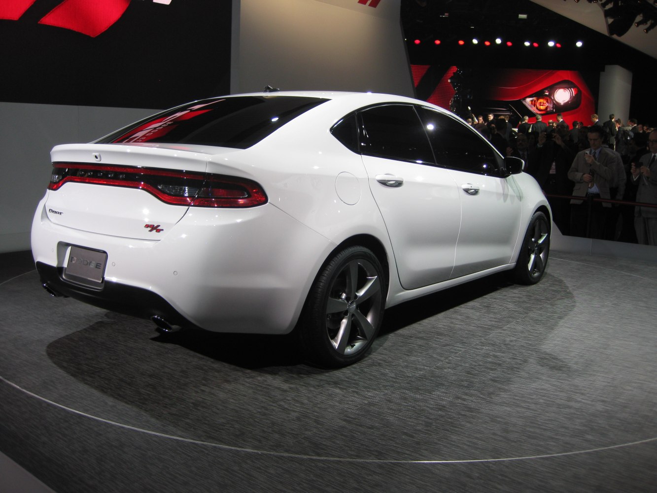 Rear view of sporty sedan with LED tail lights and alloy wheels