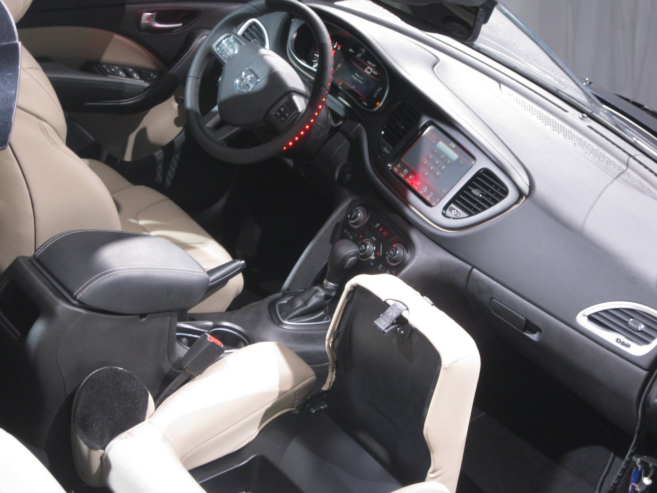 Interior view of dashboard, steering wheel, and center console