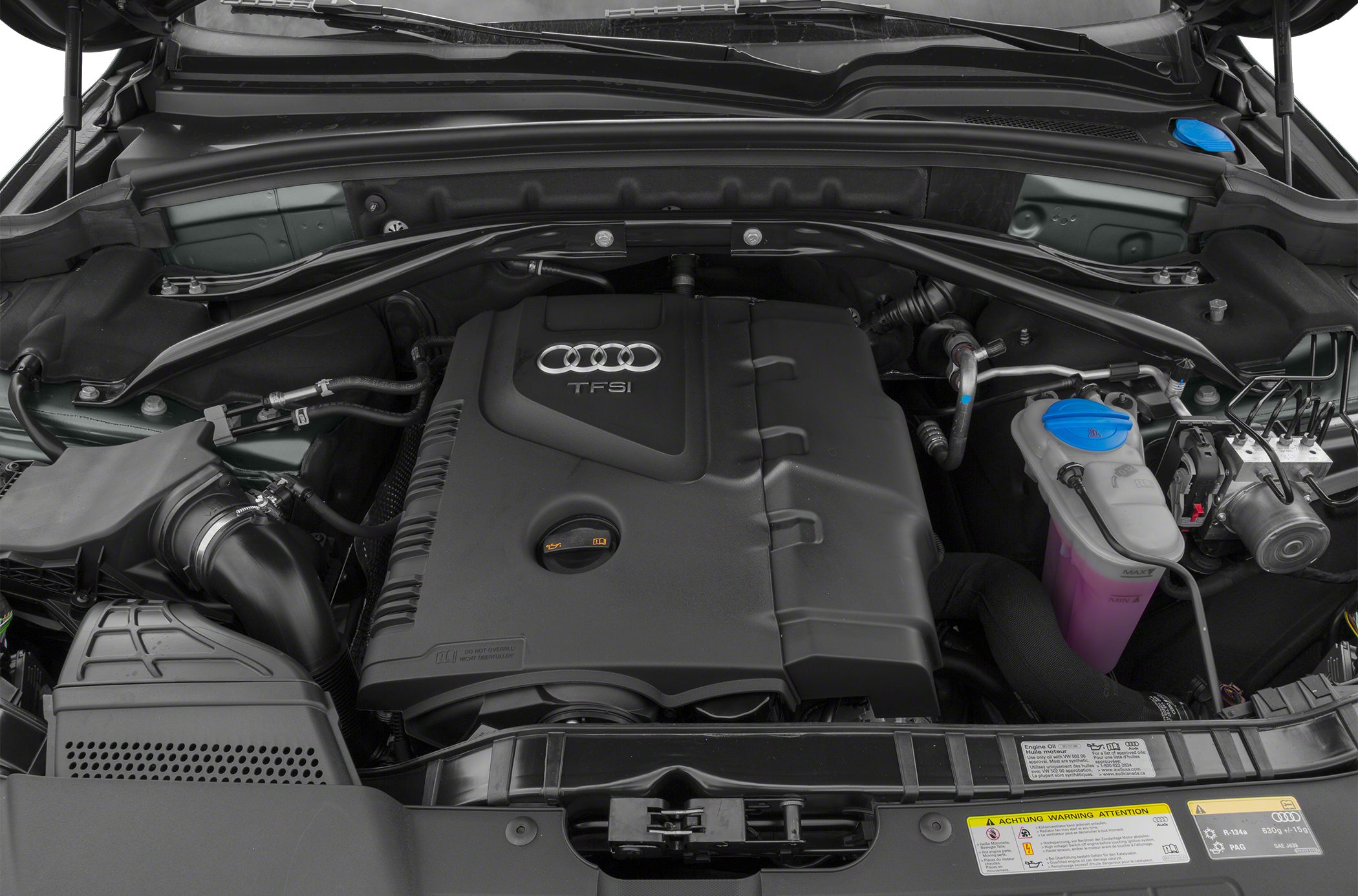 Audi TFSI engine bay with large engine cover and visible fluid reservoirs