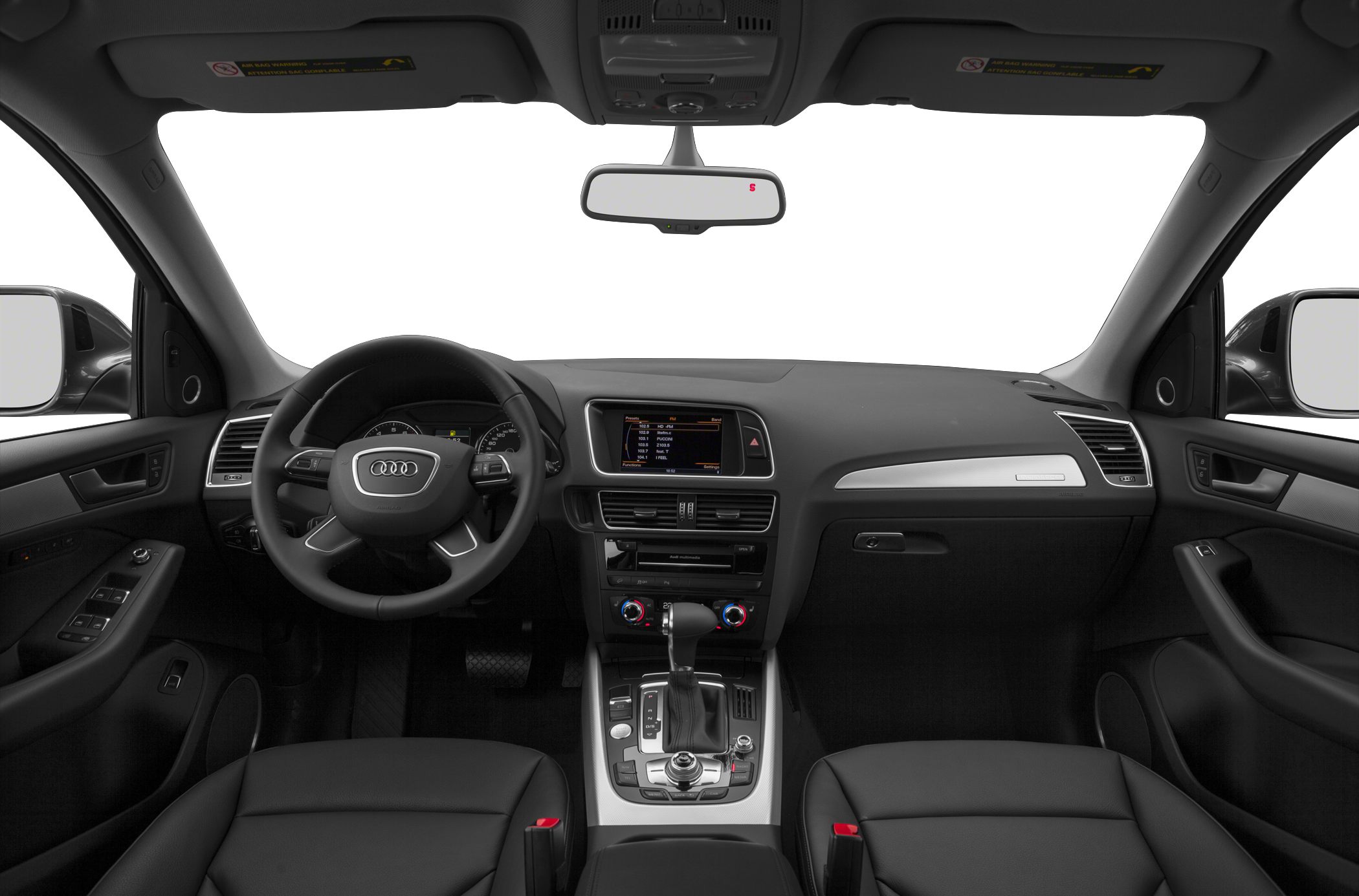 Car interior with dashboard, steering wheel, center console, and gear shift.