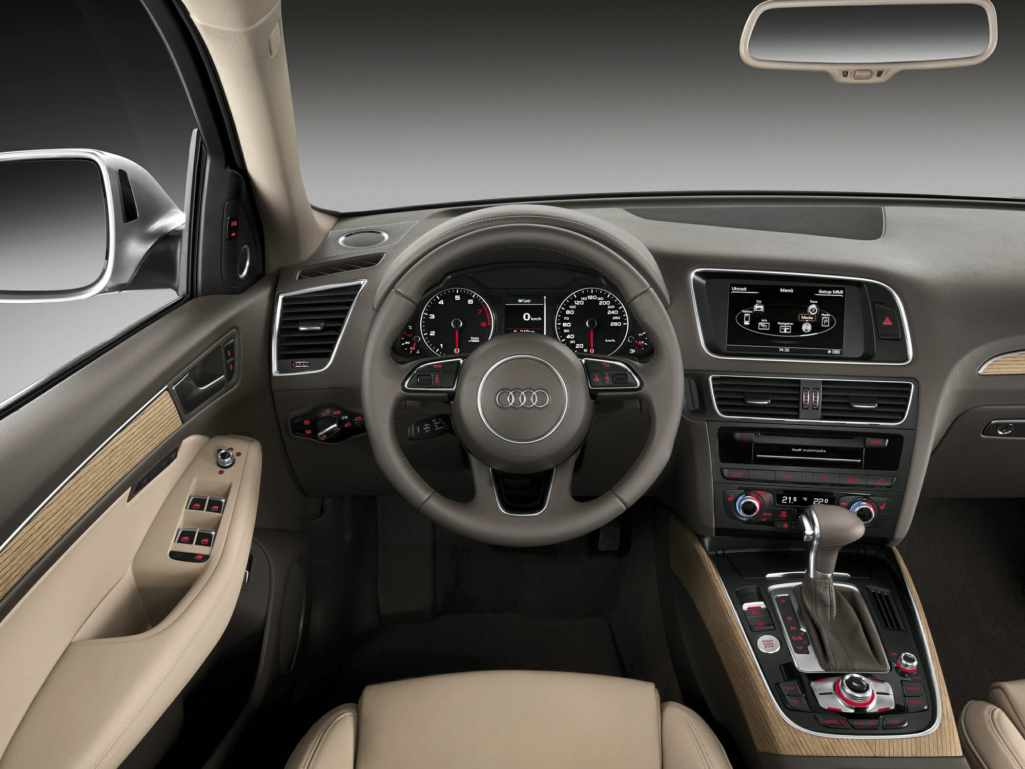 Luxury car interior with dashboard, steering wheel, and multimedia display