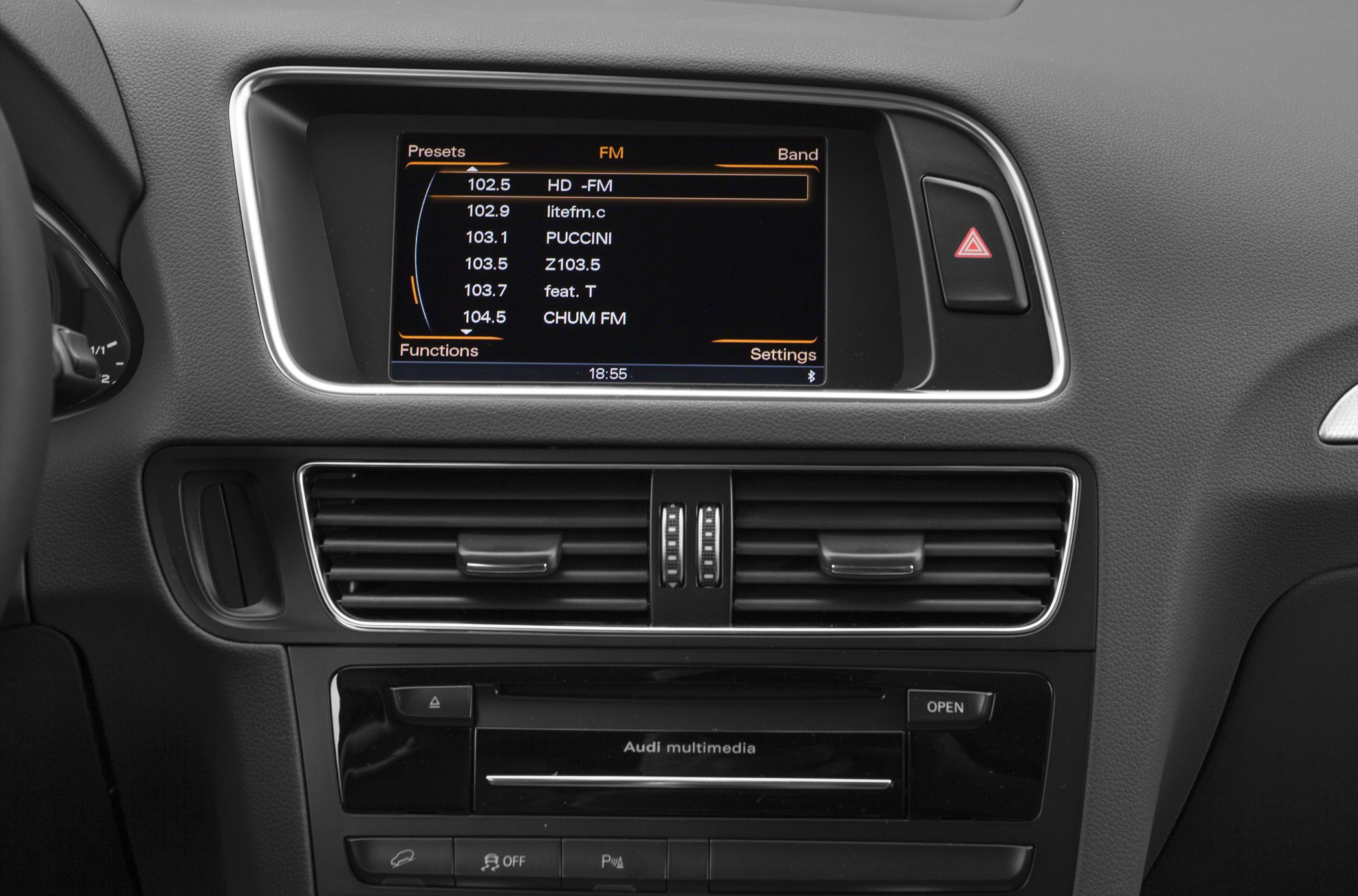Multimedia display screen and central air vents with control buttons