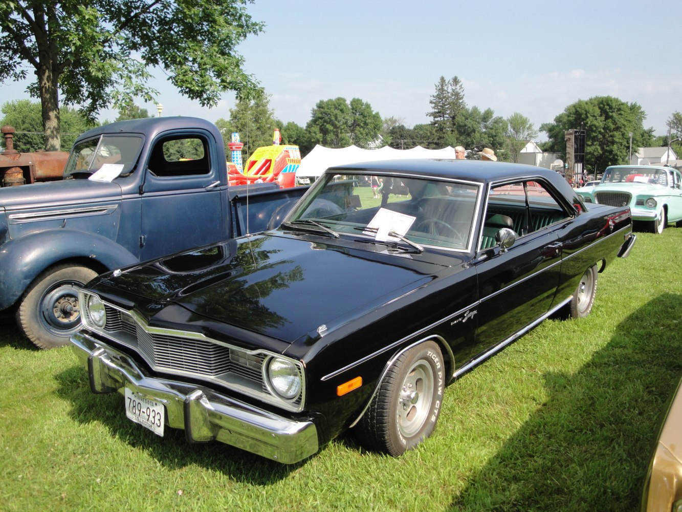 Black hardtop with chrome grille and round headlights