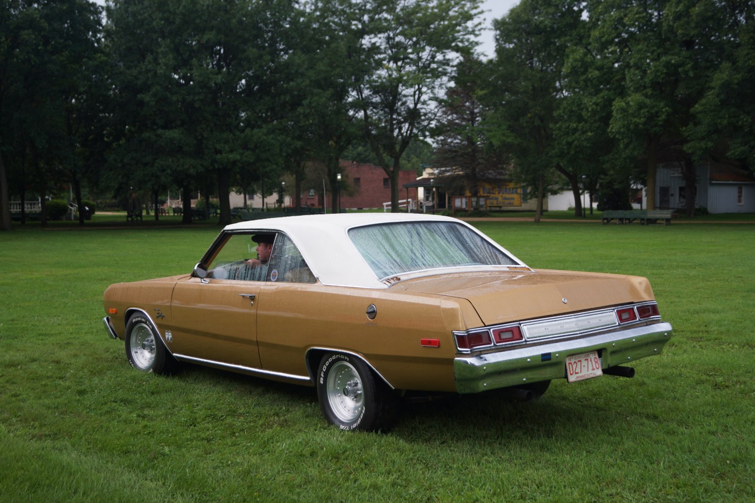 Rear and side view of two-door hardtop coupe with white vinyl roof