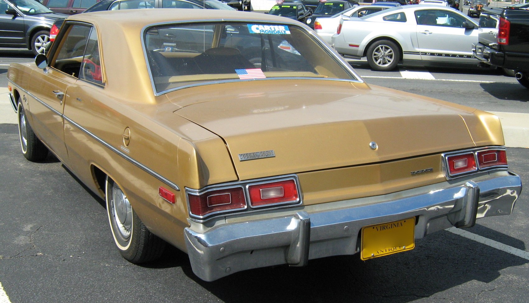 Vintage hardtop coupe rear view with distinctive taillights and chrome bumper.