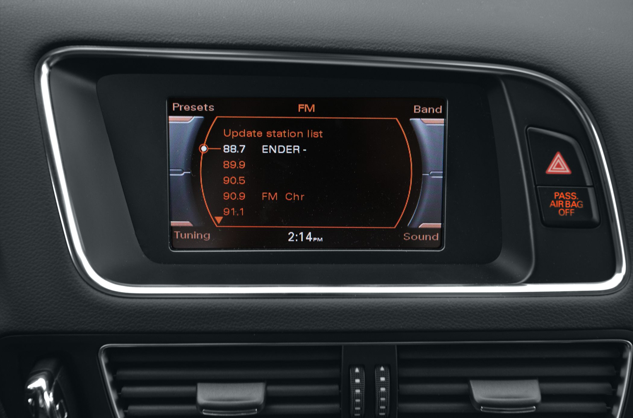 Infotainment system screen showing FM radio presets and tuning interface
