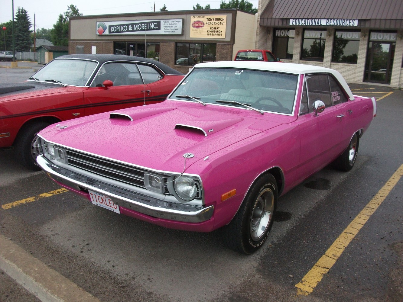 Classic hardtop coupe with dual hood scoops and two-tone roof