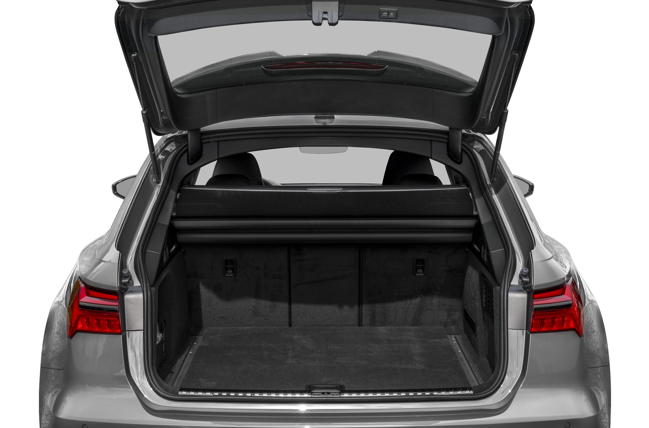 Open trunk of a luxury wagon showing spacious cargo area and rear design