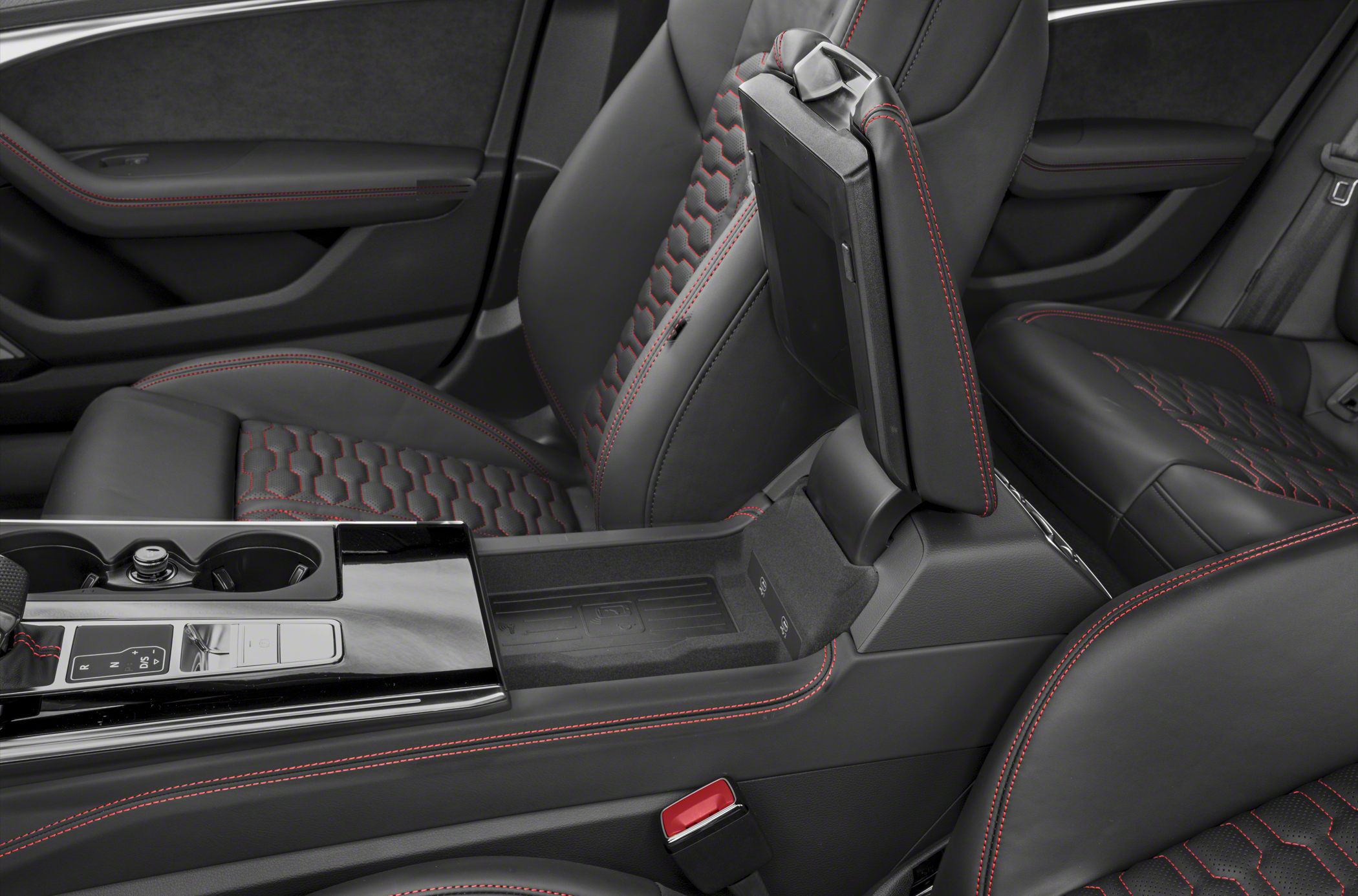 Black leather interior with red stitching and open center armrest compartment