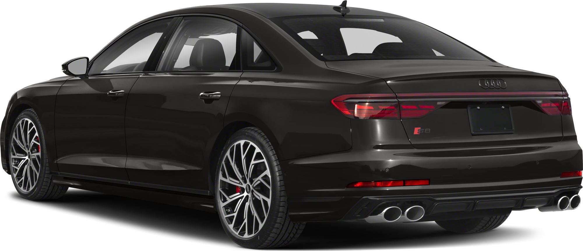 Rear three-quarter view with quad exhaust and alloy wheels