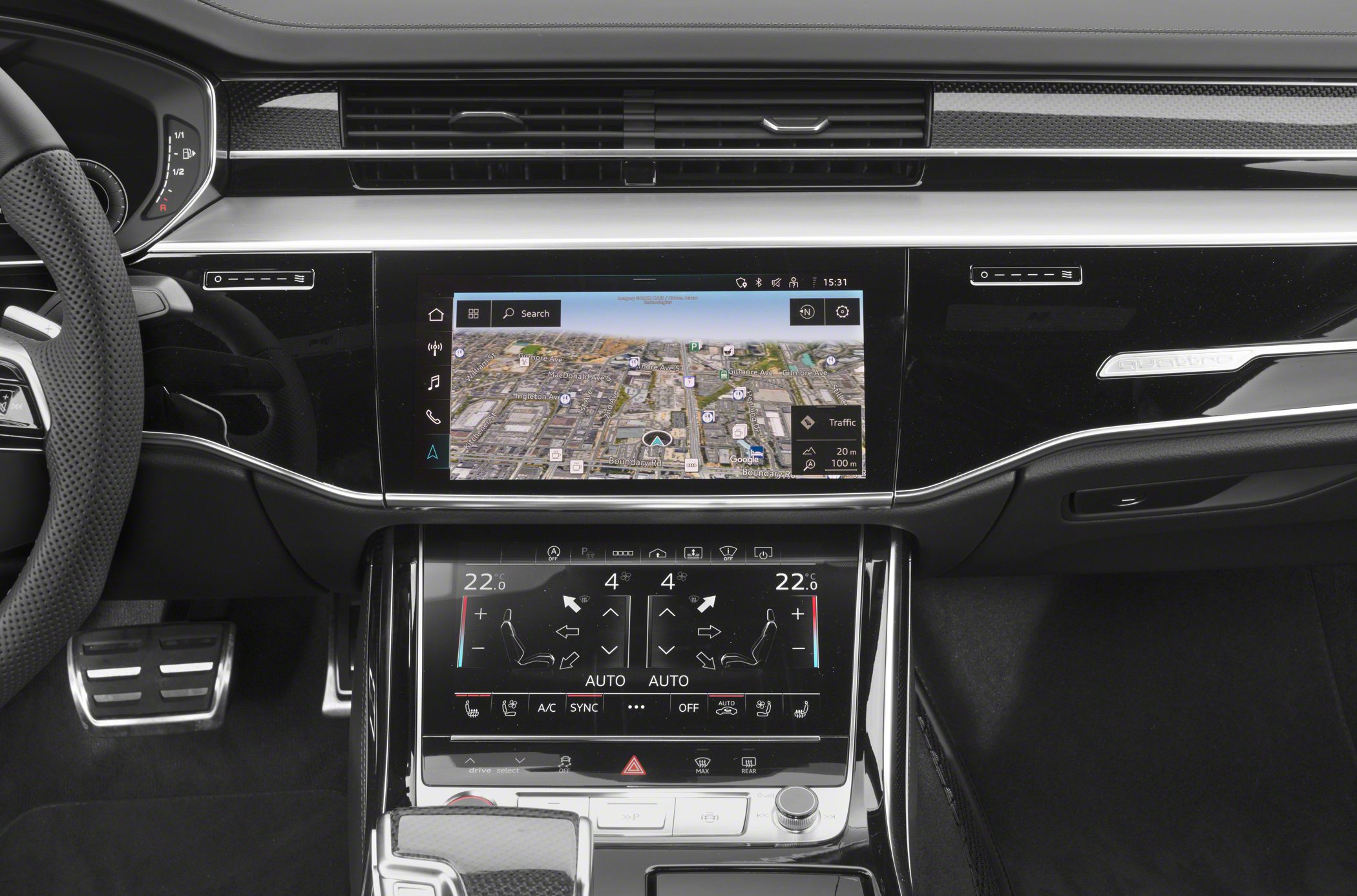 Dual touchscreen infotainment and climate control displays with digital dashboard and quattro badge