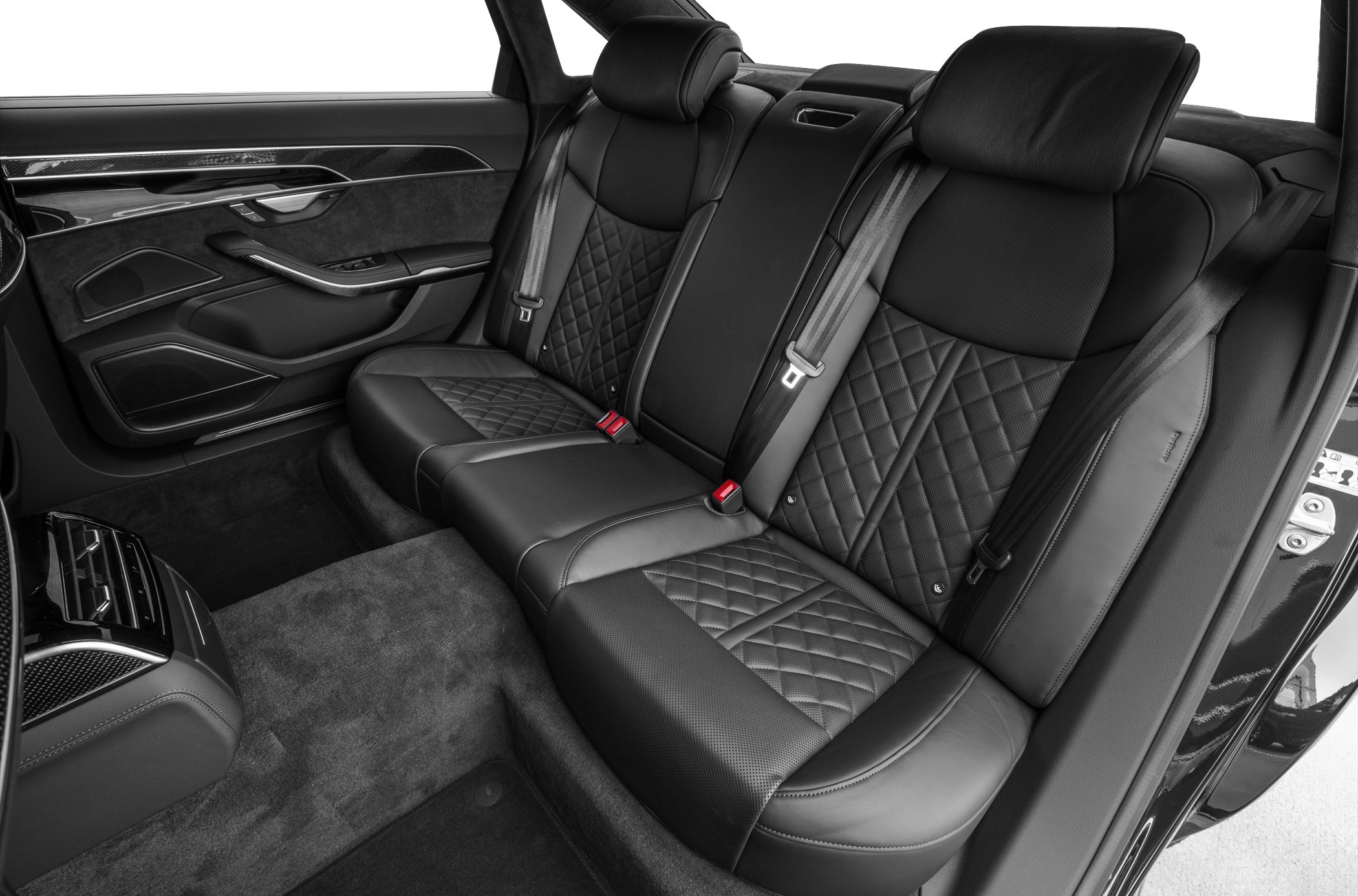 Rear leather seats with diamond stitching and detailed door panel