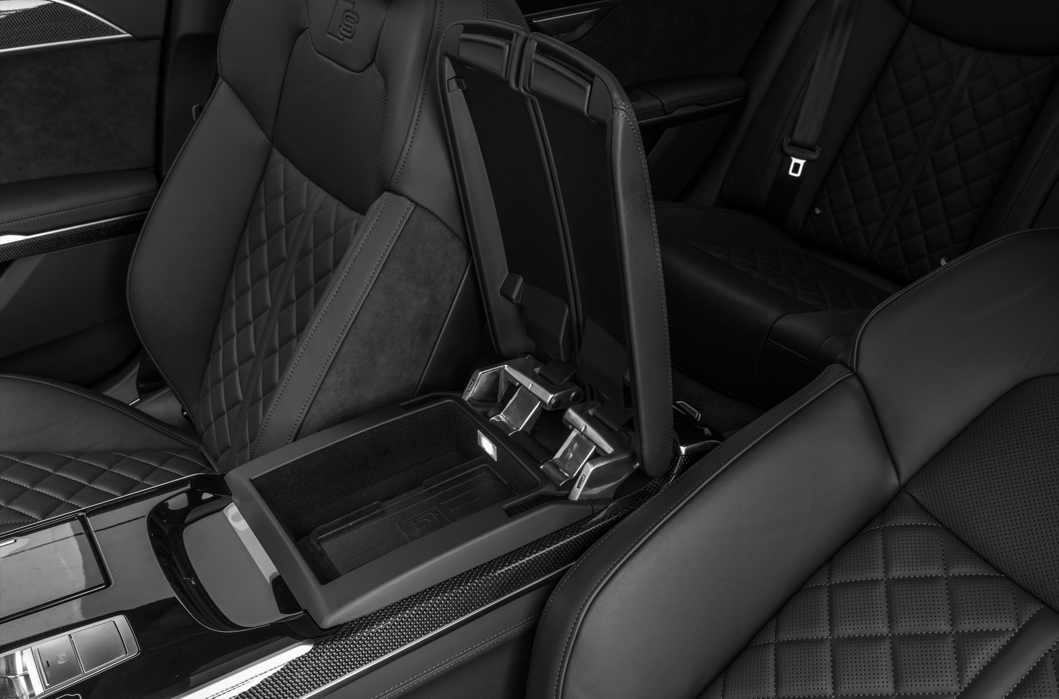 Quilted leather seats with center console storage compartment
