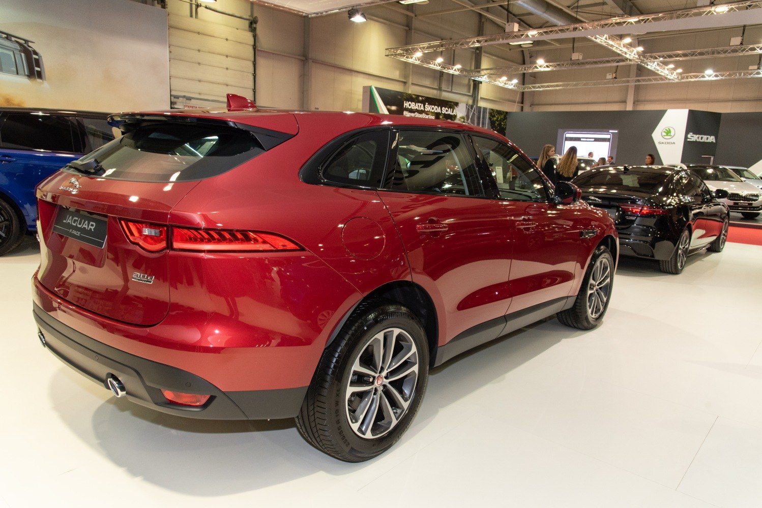Rear and side view of a red SUV with LED taillights and alloy wheels