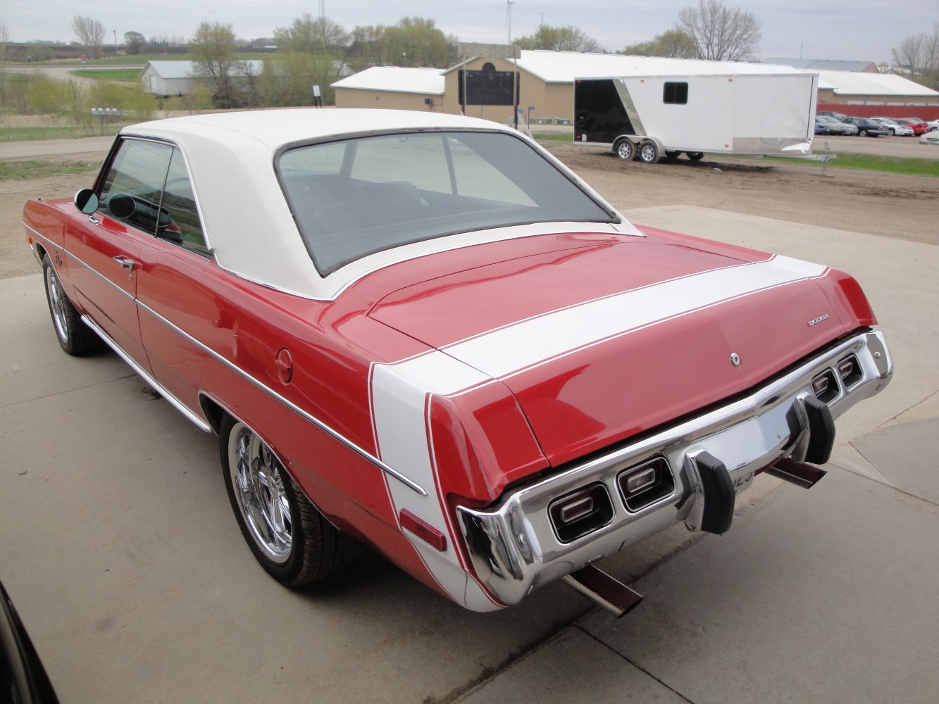 Rear and side view of classic two-tone hardtop with chrome bumper