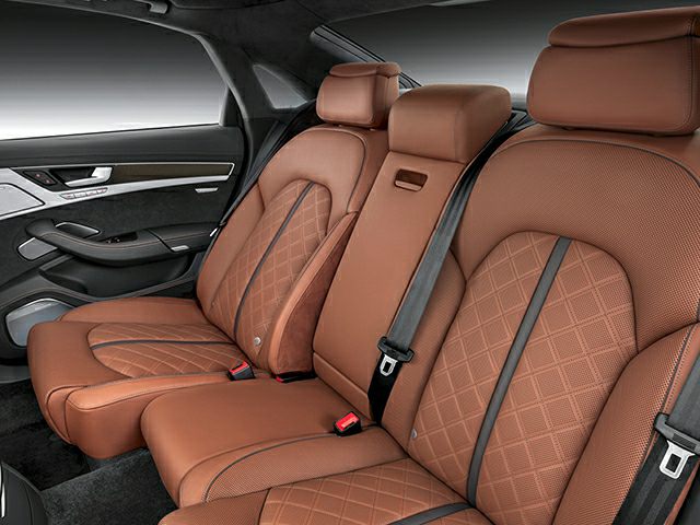 Brown quilted leather rear seats with seatbelts and door interior