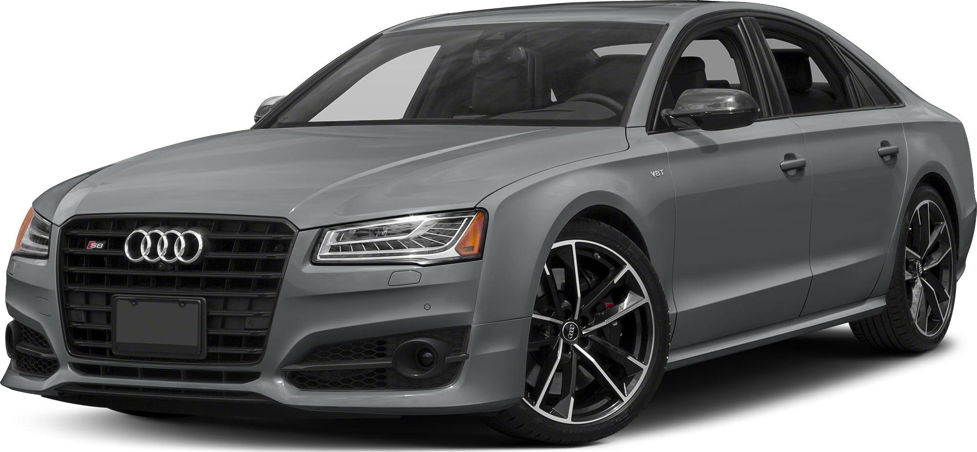 Luxury sedan front with aggressive grille, LED headlights, and sporty alloy wheels