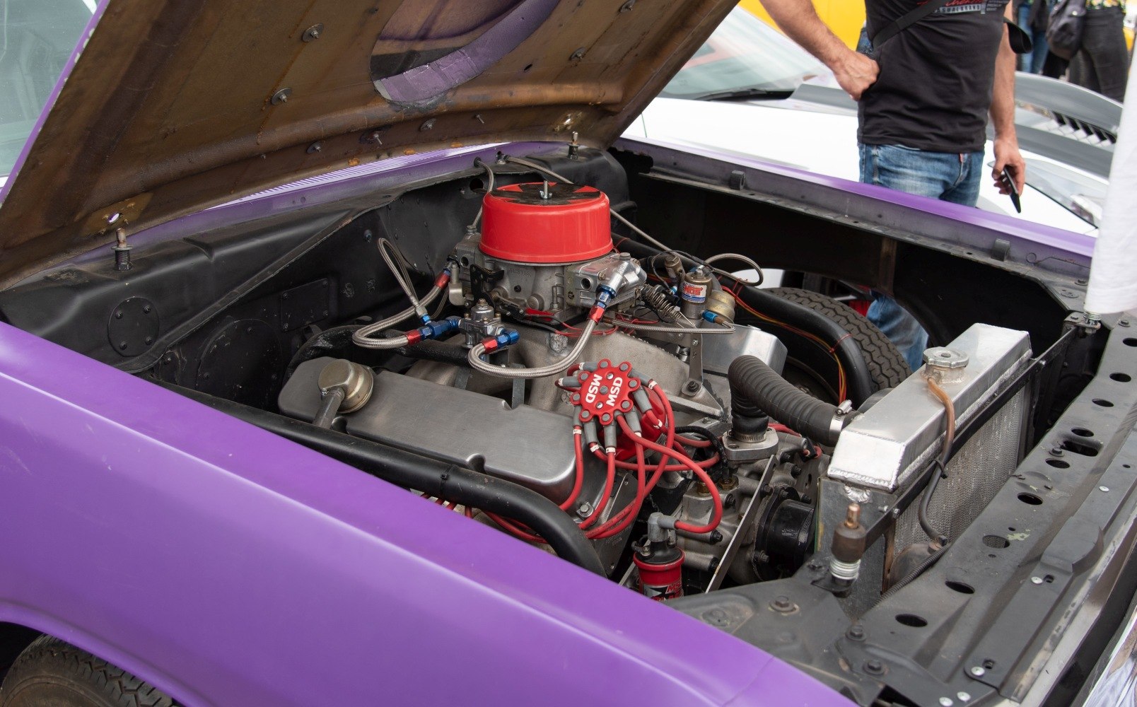 High-performance engine with red ignition wires in classic muscle car