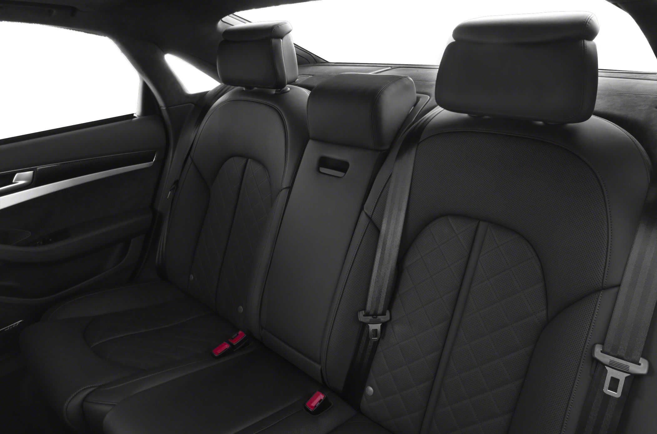 Black quilted leather rear seats with headrests and seat belts.