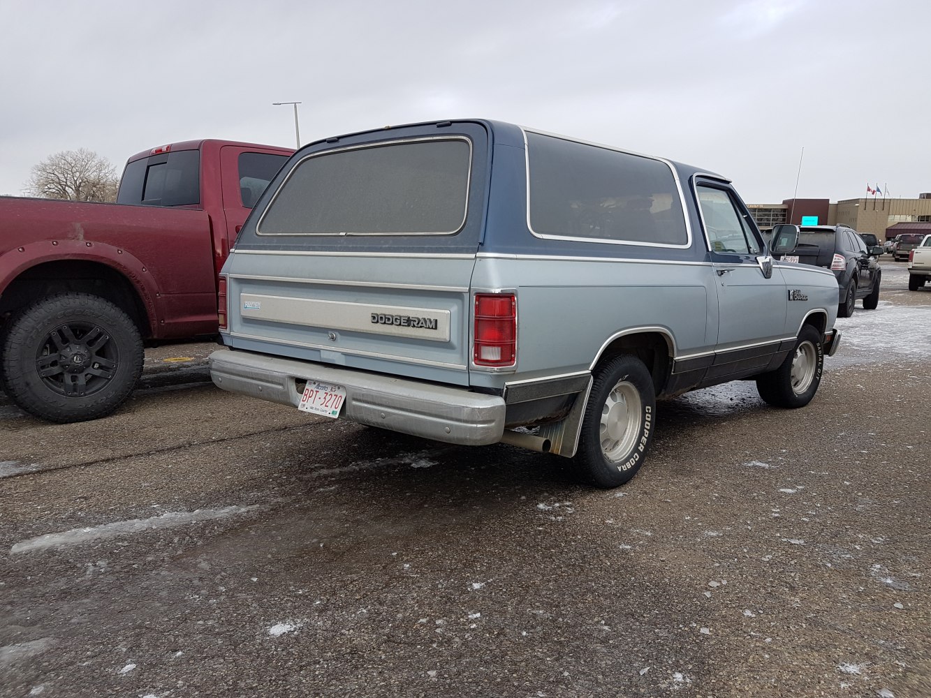 Vintage SUV rear and side view with iconic taillights and rugged design.
