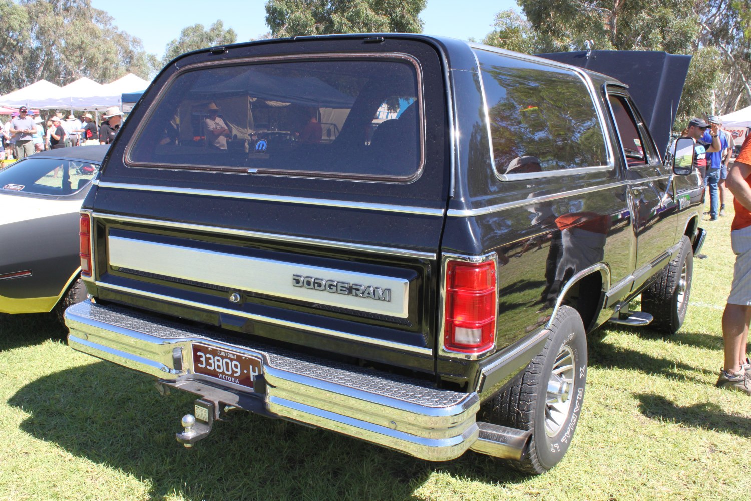 Chrome rear bumper, rectangular tail lights, tinted rear window