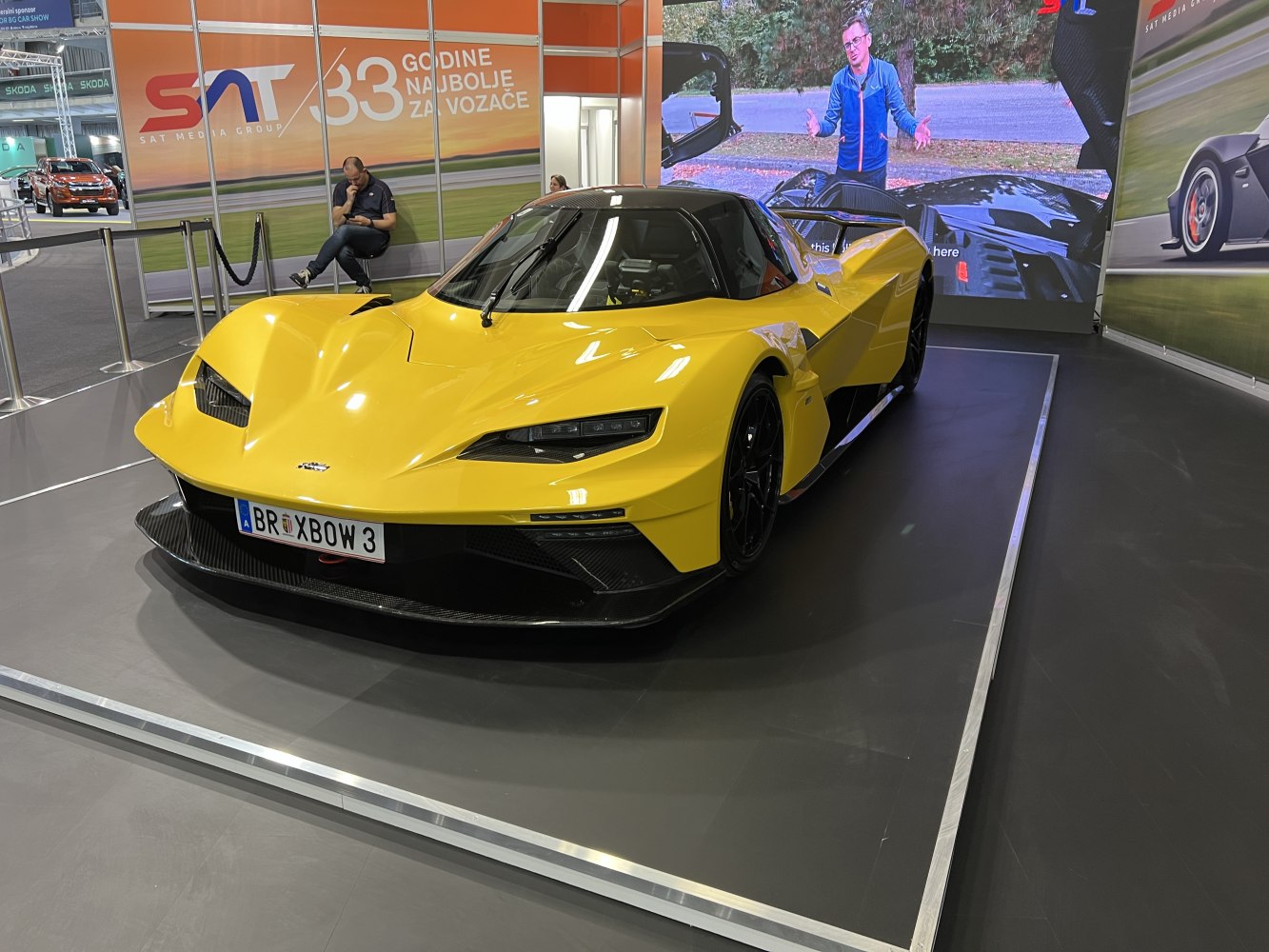Yellow sportscar with aerodynamic front and LED headlights
