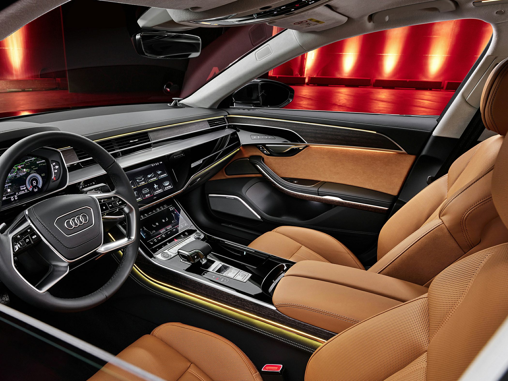 Digital instrument cluster, dual touchscreen center console, tan leather seats, ambient lighting