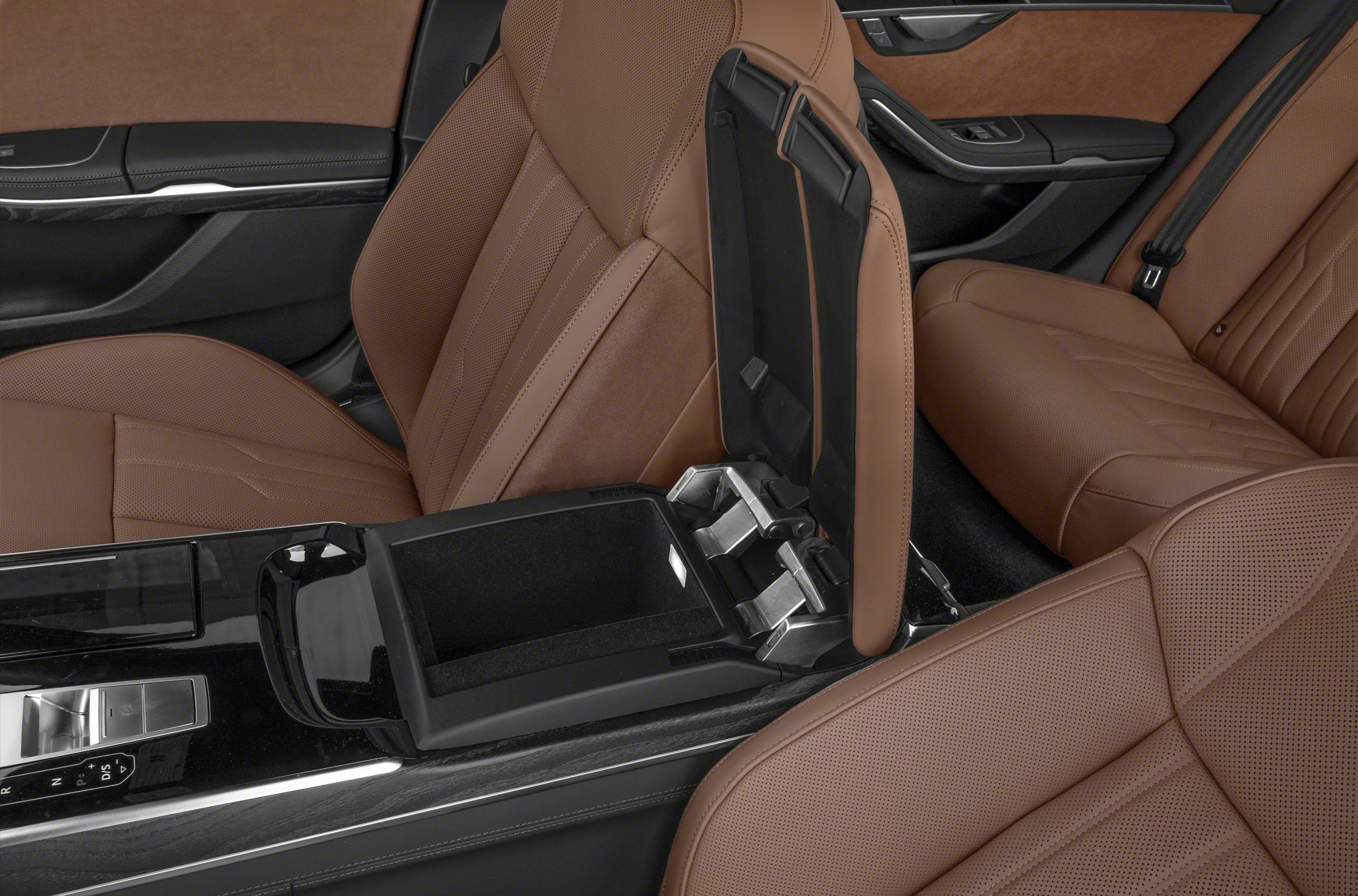 Brown perforated leather seats with open center console storage and luxury interior details