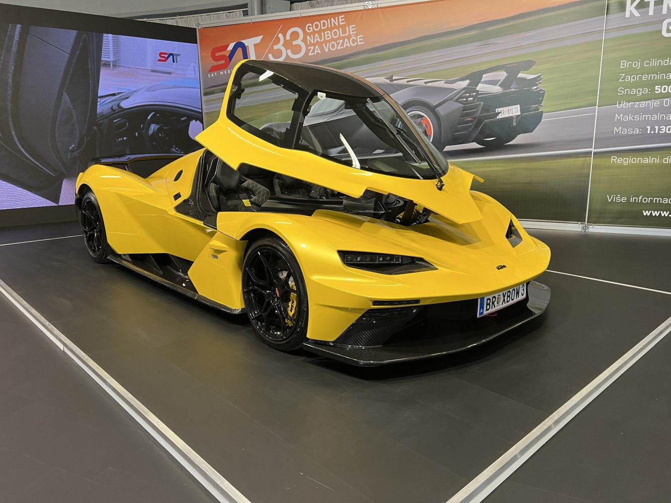 Yellow sports car with canopy-style door opened