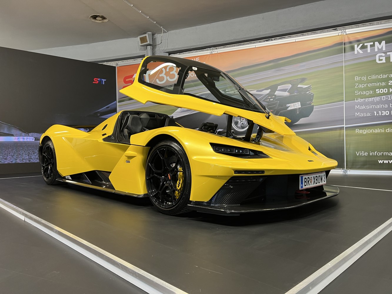 Yellow sports car with gullwing doors and aerodynamic body