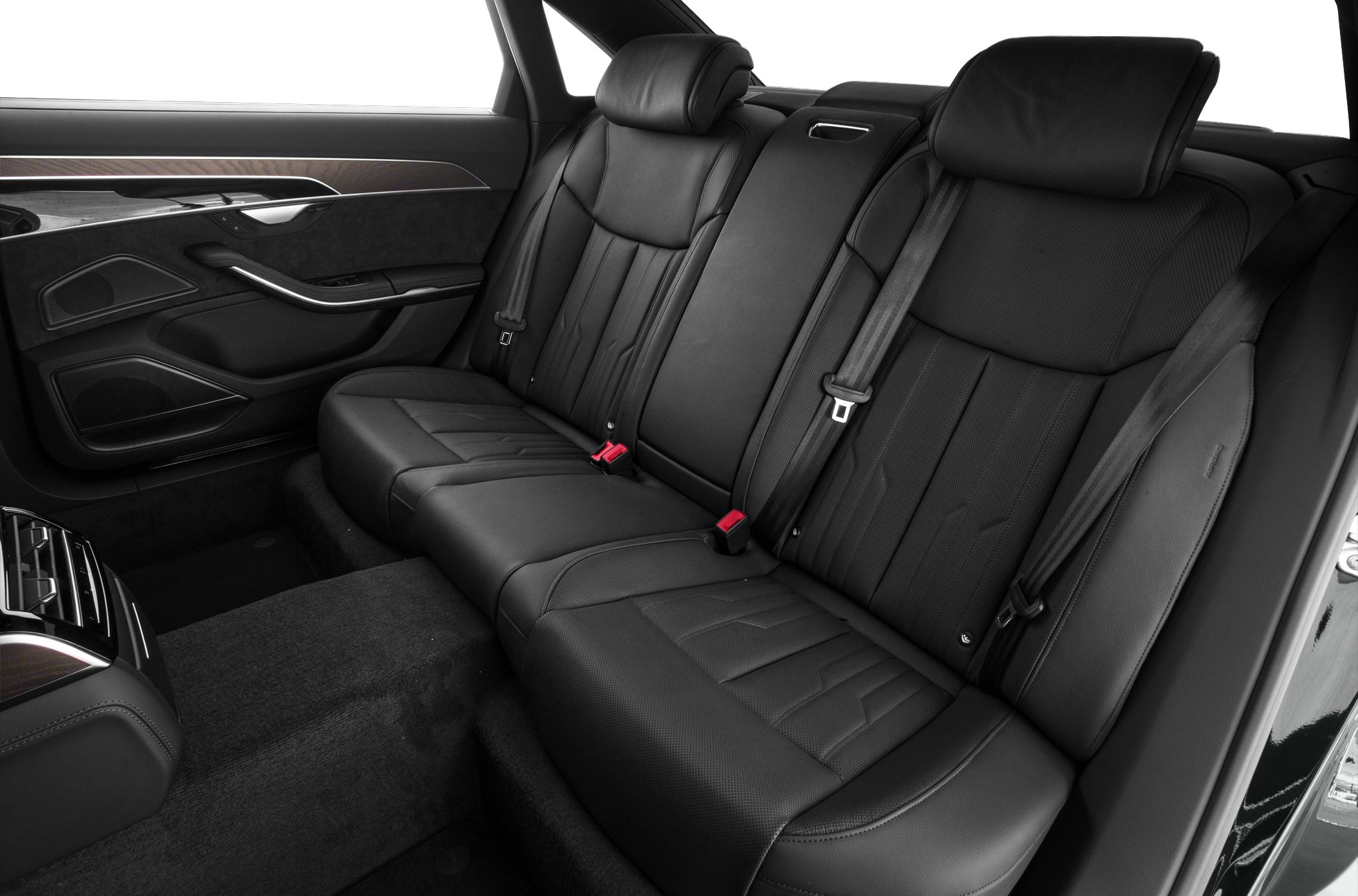 Luxury black leather rear seating with wood trim and detailed stitching