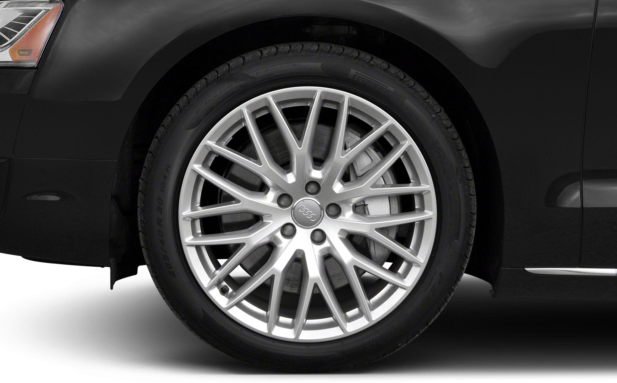 Close-up of a 20-inch multi-spoke alloy wheel and tire on a luxury sedan