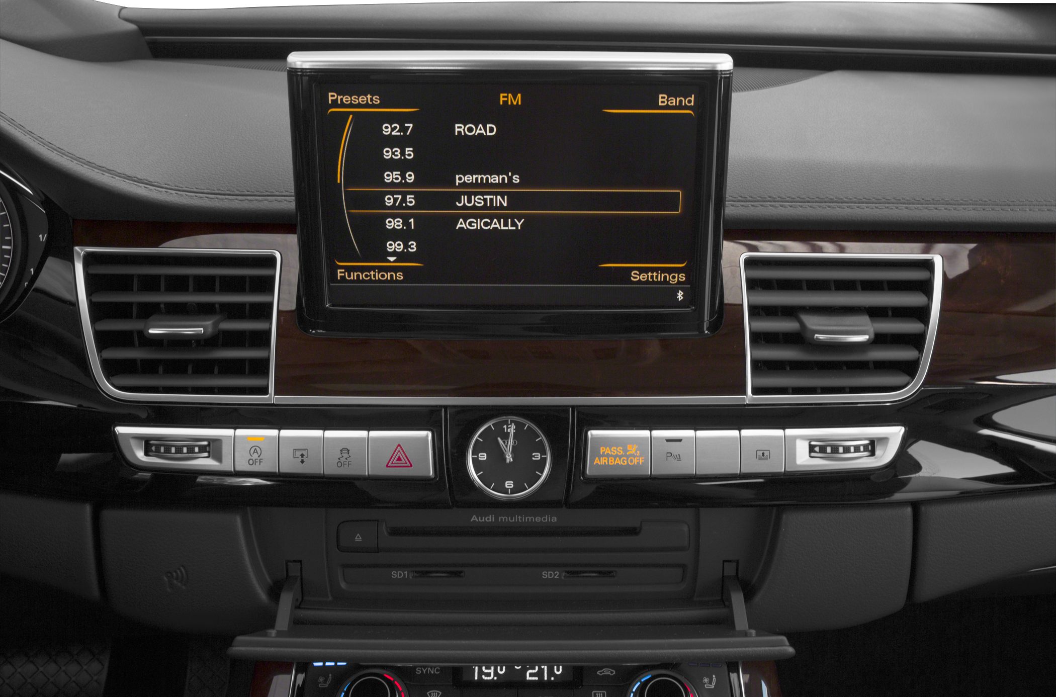 Multimedia display and dashboard controls with analog clock and air vents