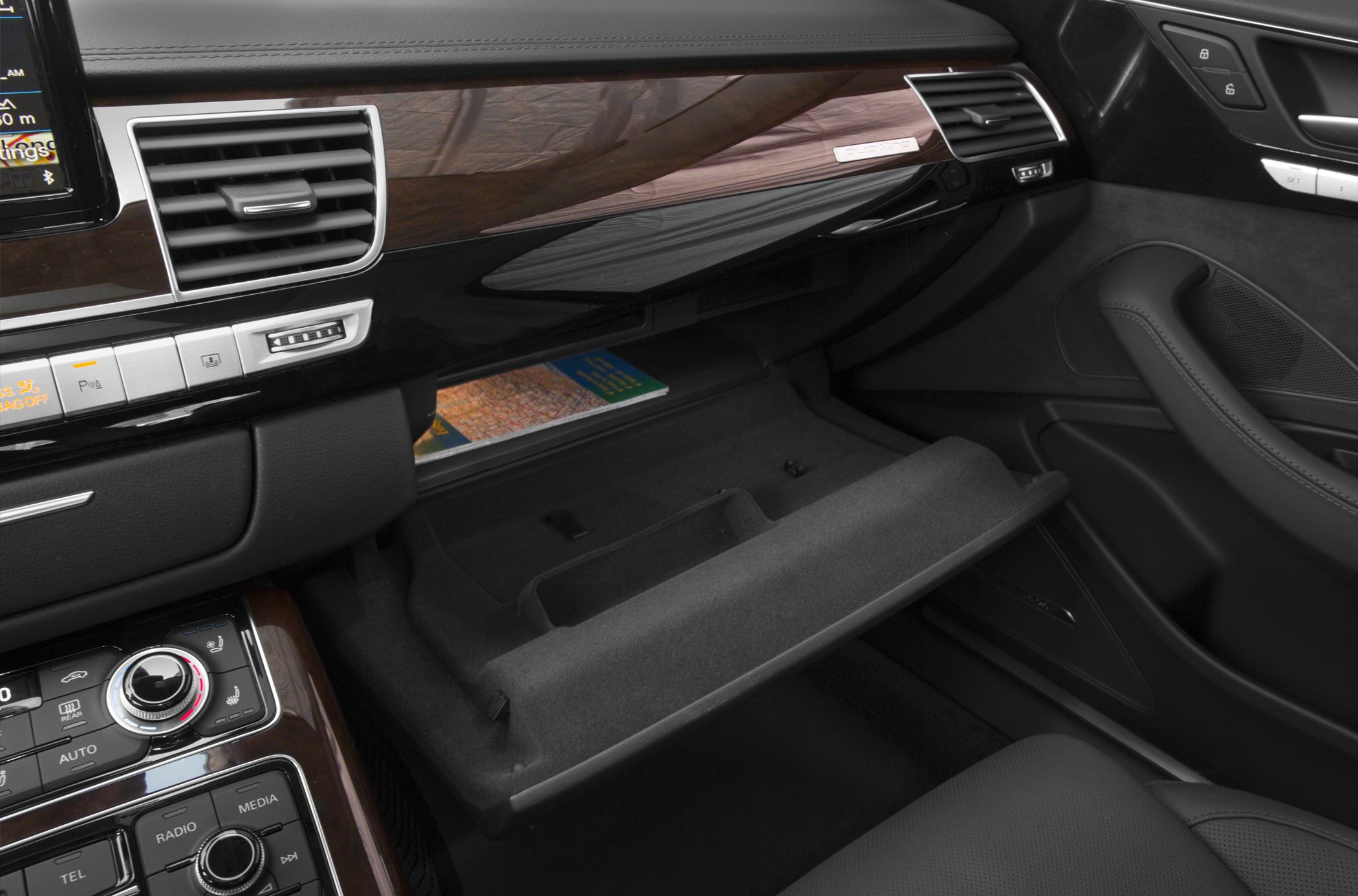 Open glove compartment and wood trim dashboard interior