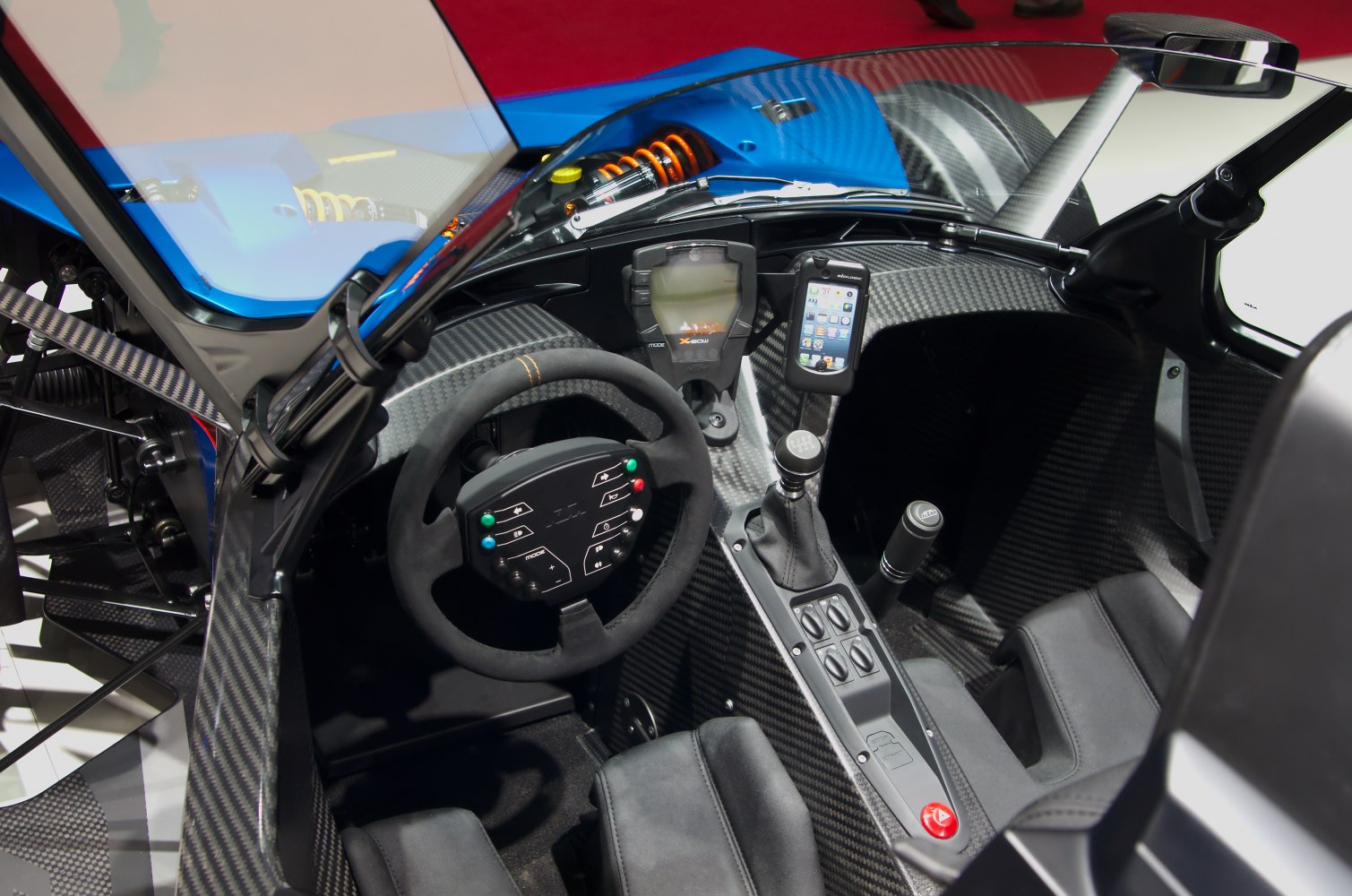 Racing steering wheel, carbon fiber cockpit, manual gear shifter