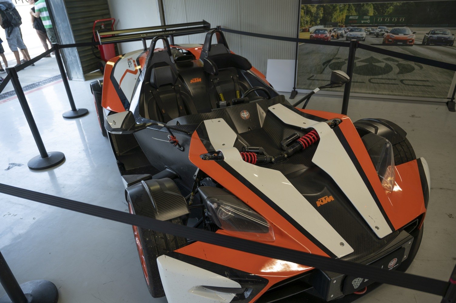 Open-wheel design with exposed front suspension shock absorbers and dual racing seats.