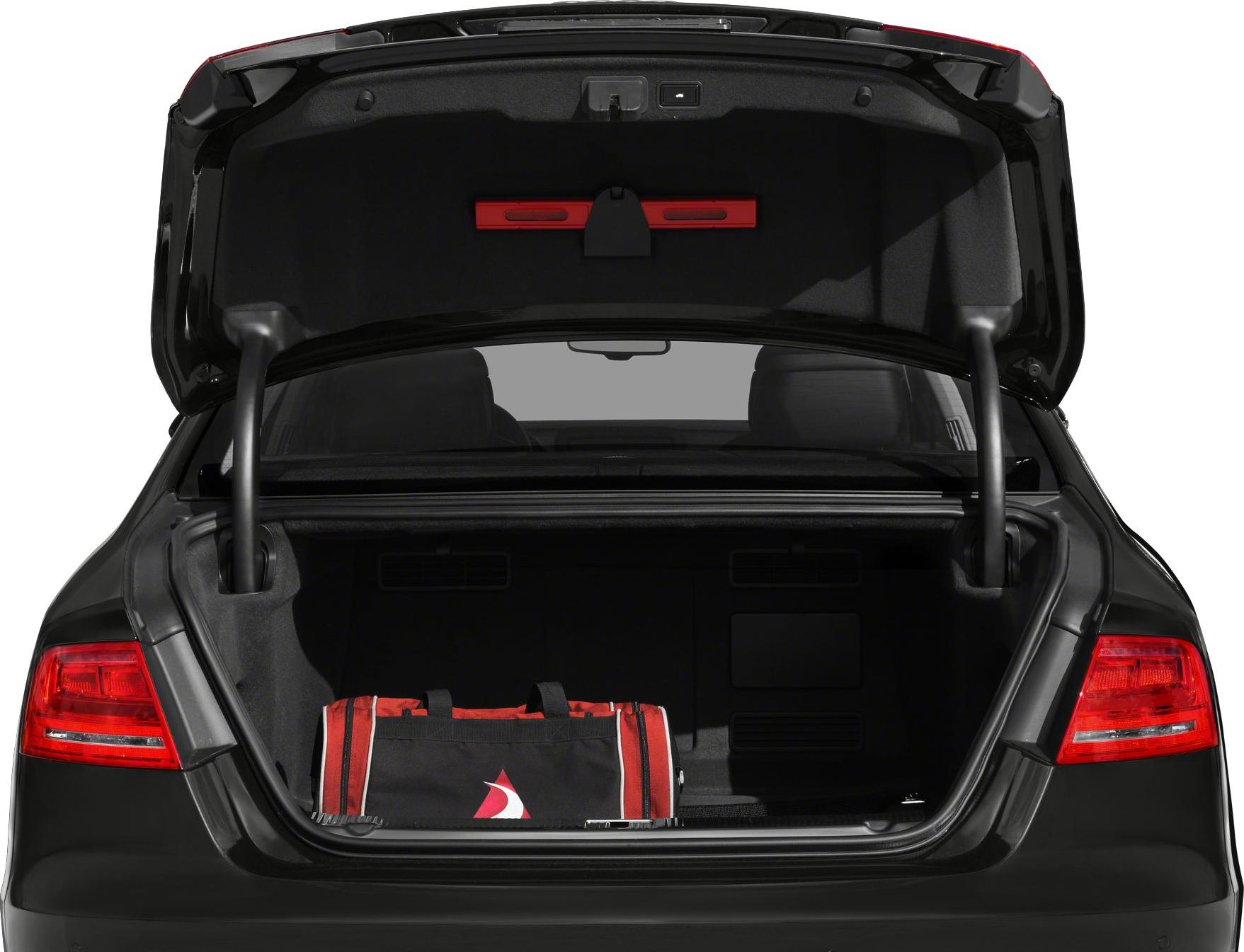 Open spacious sedan trunk with red bag inside