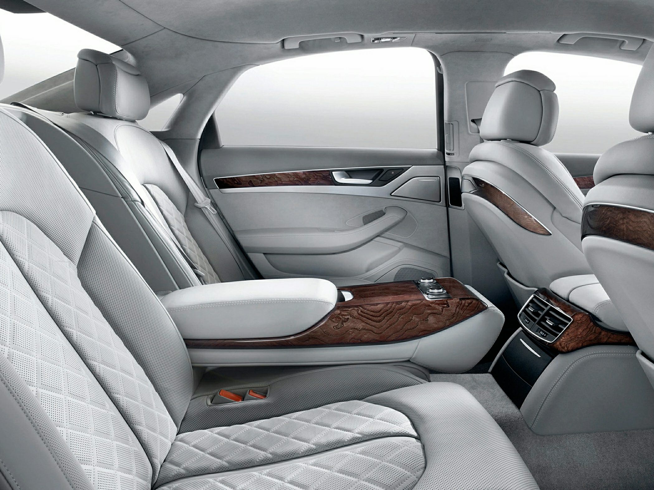 Luxurious rear seating with quilted leather and wood trim