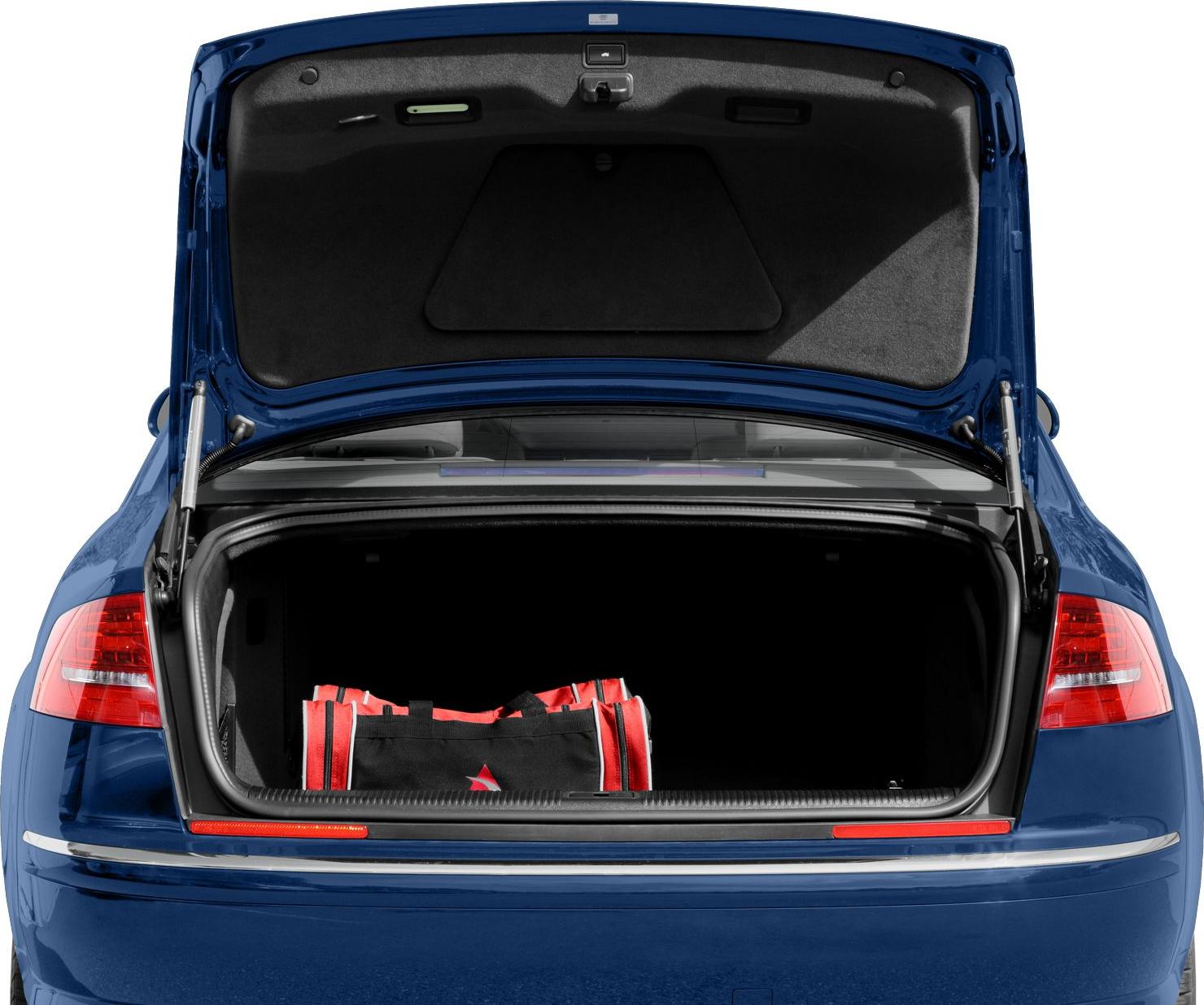 Open trunk with visible emergency kit in blue sedan