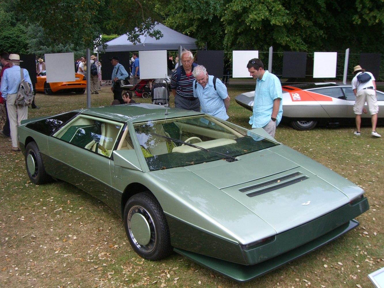 Futuristic wedge-shaped low profile car with aerodynamic design.
