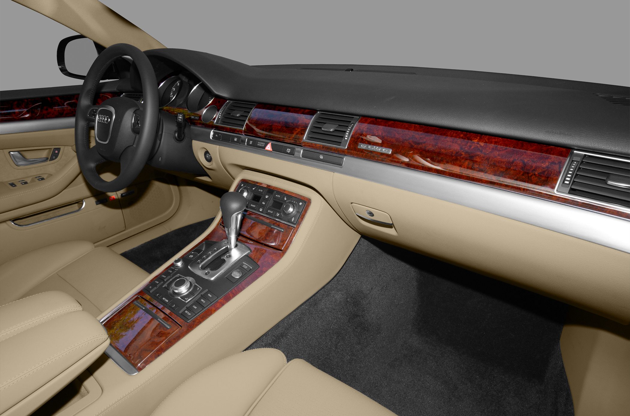 Luxury beige leather interior with wood trim and advanced control panel
