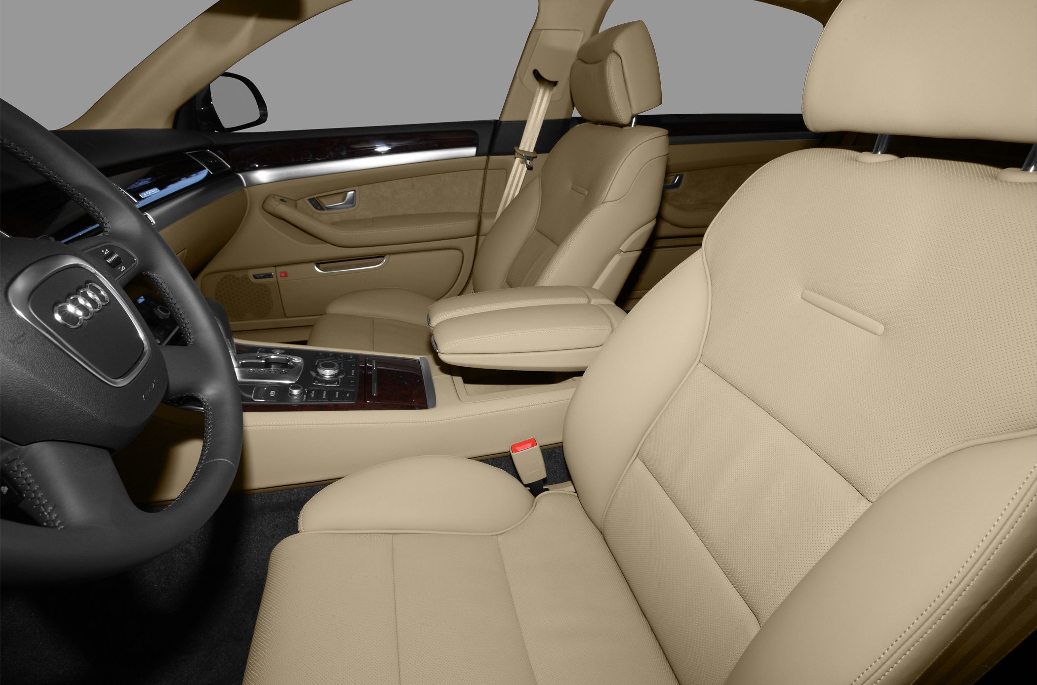 Beige leather seats with detailed stitching and advanced central control panel